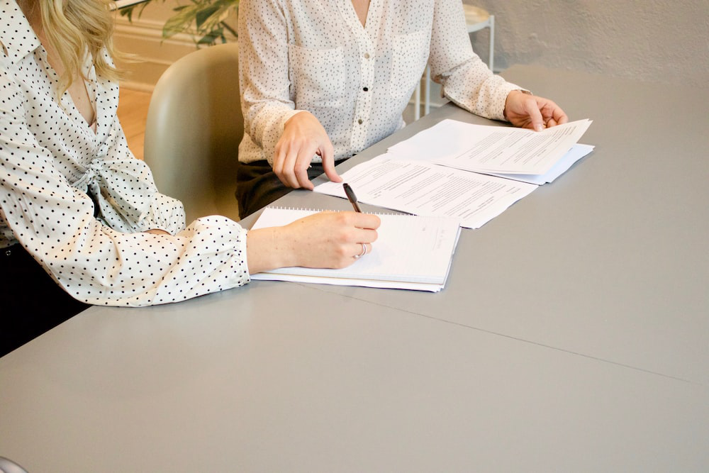 A person signing documents during the rescission period