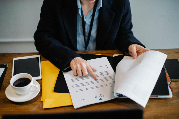 A woman reading official documents