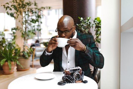 A person relaxing while sipping coffee