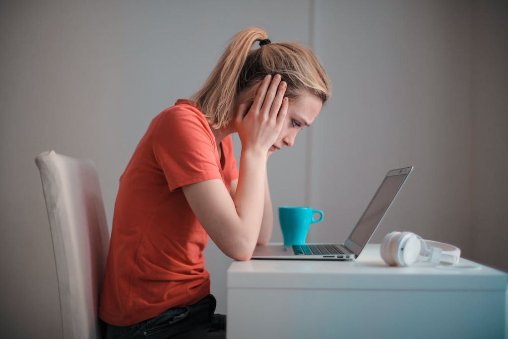 A woman looking at a laptop